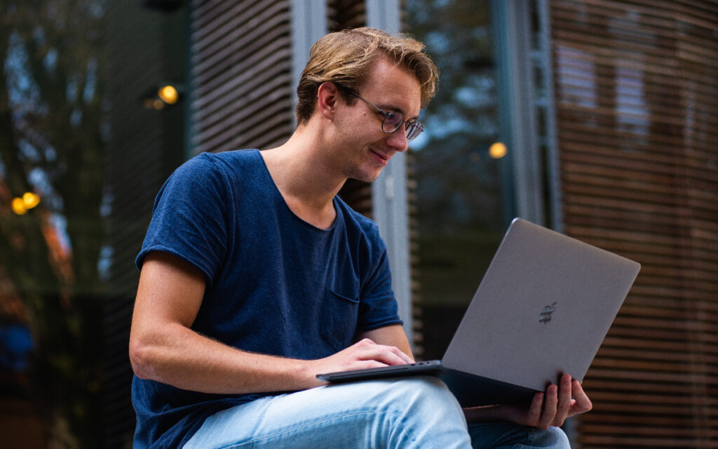 IT specialist helping with a laptop's battery life.