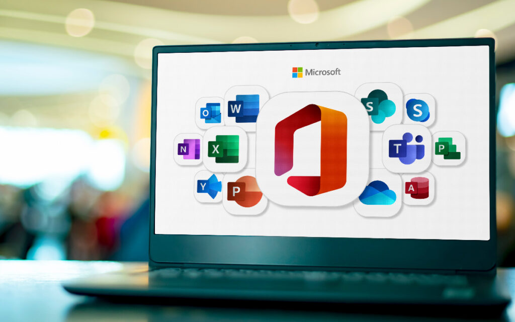 Laptop computer displaying logos of Microsoft Office.