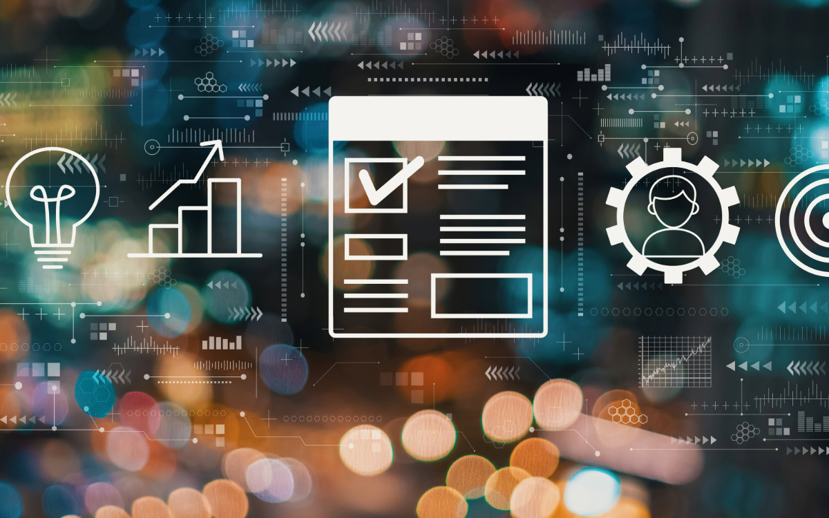 Digital symbols and a checkbox on a digital sheet representing IT project management.