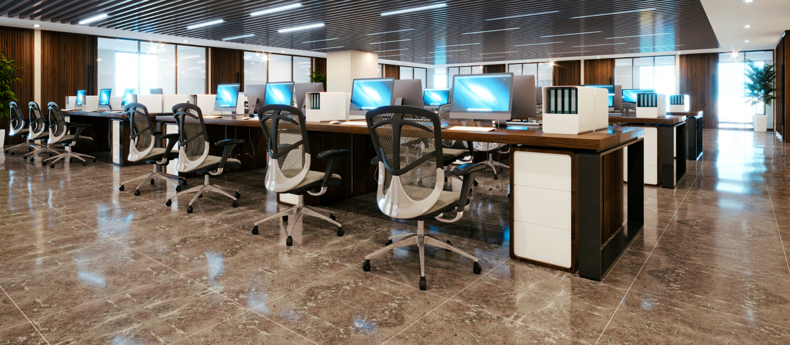 An office floor showing rows of new computers that are recent technology upgrades.