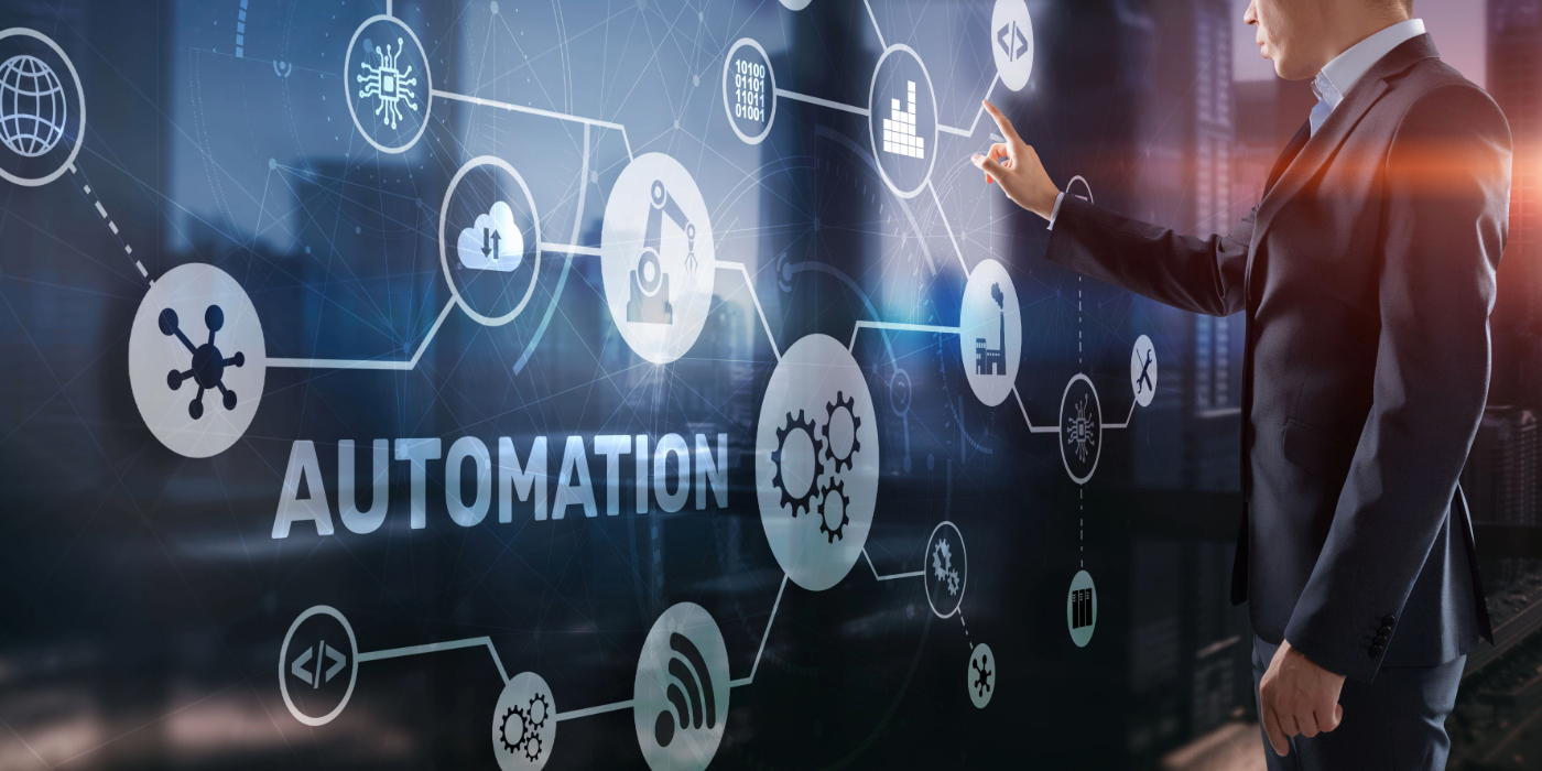 A man standing in front of a workflow automation planner with the words automation.