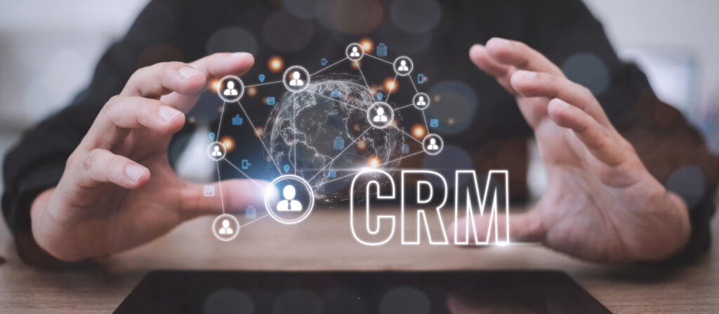 Two hands holding a digital crm system.